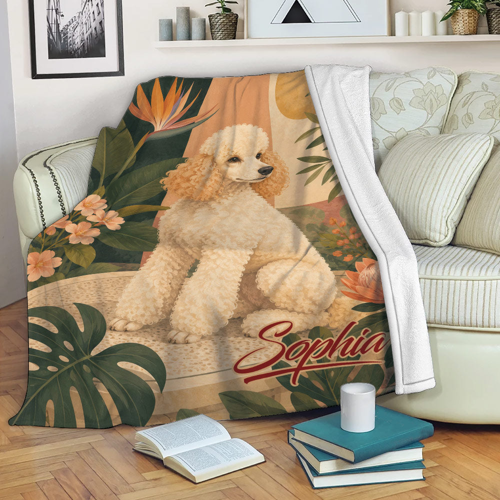 Custom poodle blanket draped over a sofa, featuring tropical leaves, flowers, and warm decorative colors