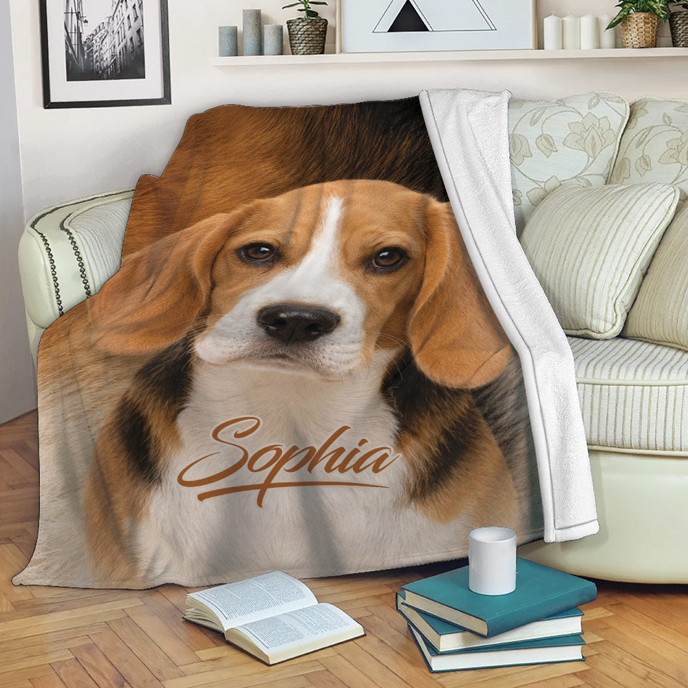 Beagle blanket draped over a sofa with realistic dog artwork in a cozy living room