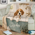 Beagle blanket spread across a sofa featuring a warm vintage bathtub illustration