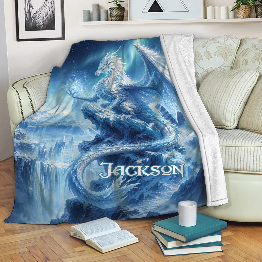 Blue fantasy dragon throw blanket draped over a sofa in a cozy reading space