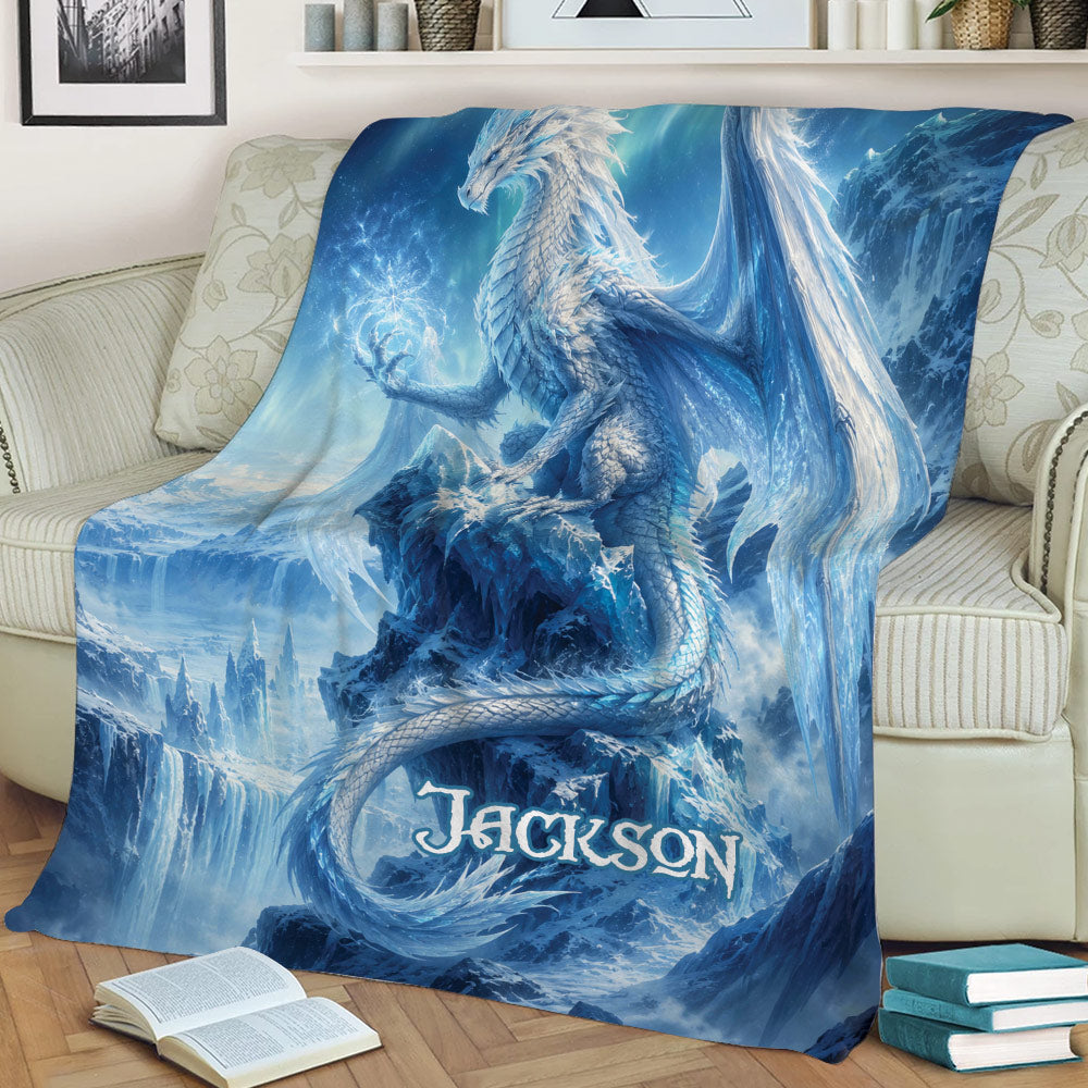 Fantasy ice dragon throw blanket styled across a sofa with icy mountain artwork