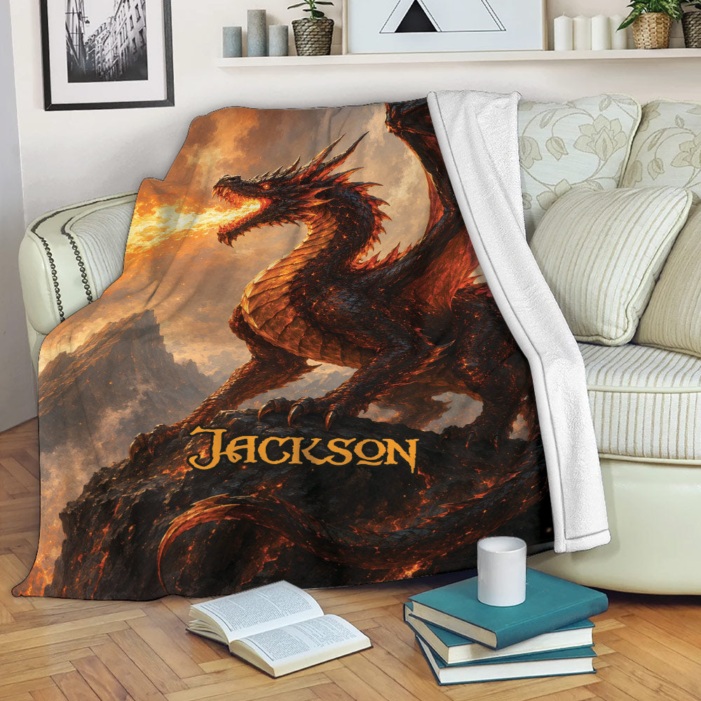 Dragon blanket draped over a sofa with fiery fantasy artwork and a winged dragon scene