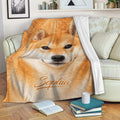 Shiba Inu blanket draped over a sofa in a cozy living room setting