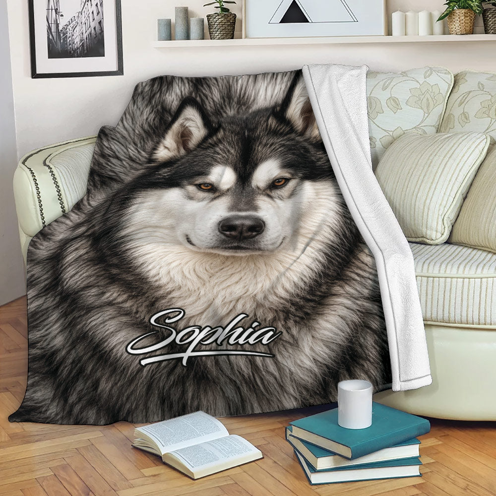 Alaskan Malamute blanket draped over a sofa with realistic black and white dog artwork for cozy lounging