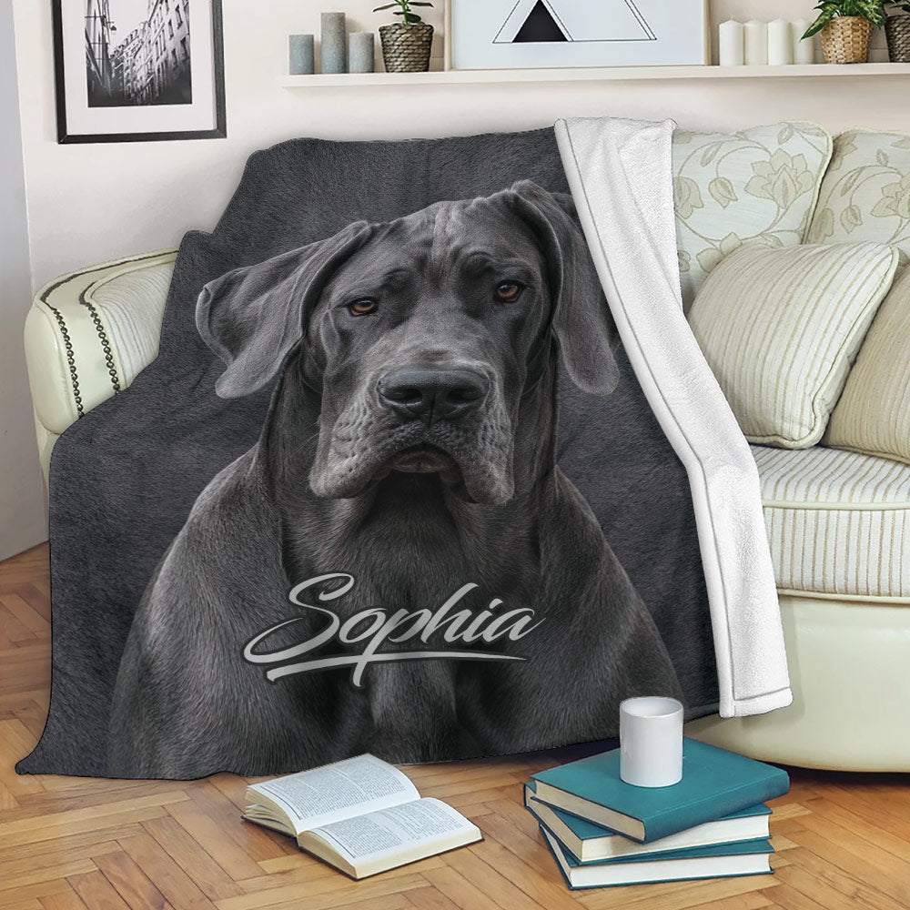 Great Dane blanket draped over a sofa, featuring a realistic gray dog portrait in a cozy living room