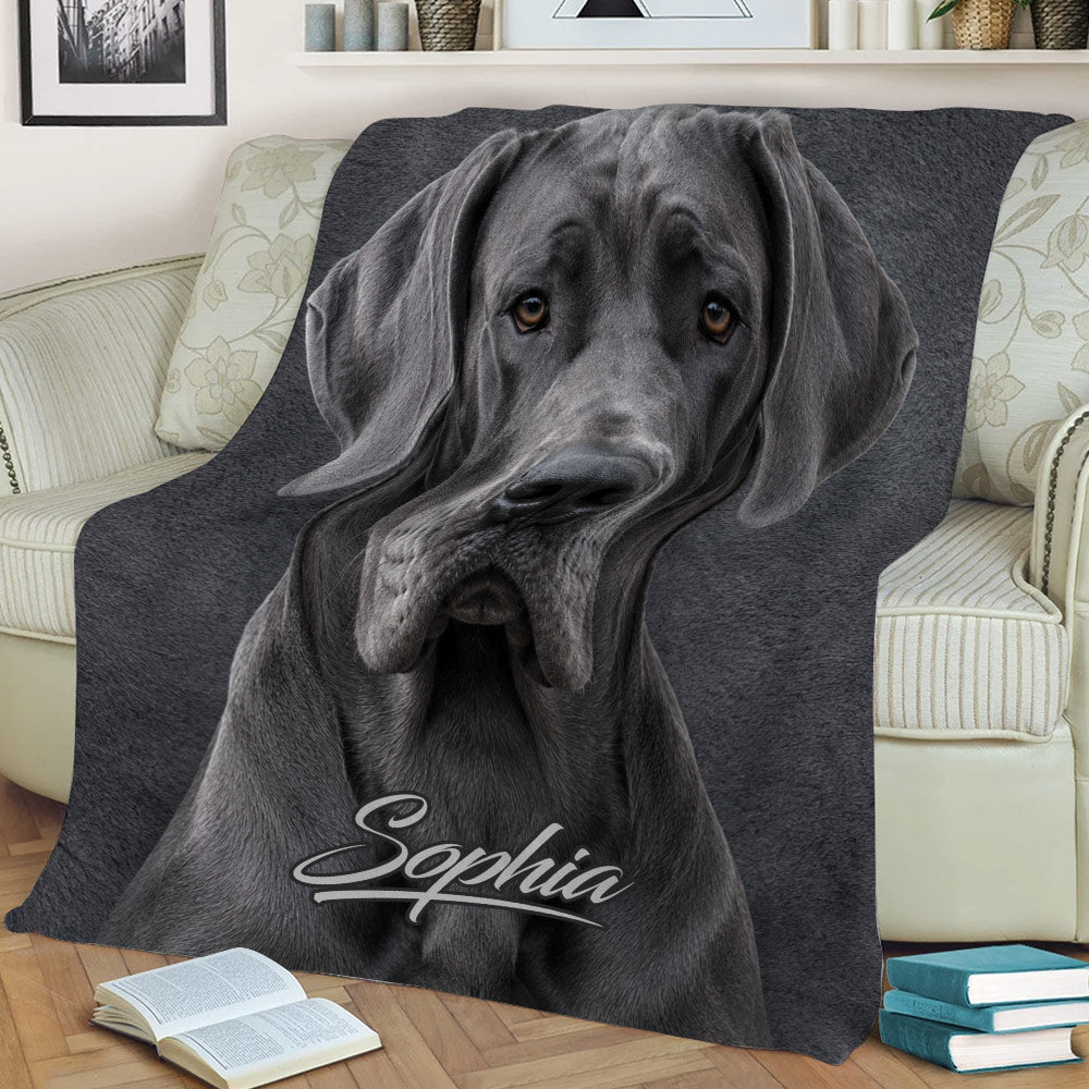 Great Dane throw blanket styled on a sofa with a close-up gray dog portrait and dark artwork