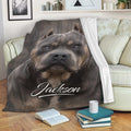 American Bully throw blanket featuring a gray dog design draped across a living room sofa