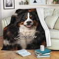 Bernese Mountain Dog blanket draped across a sofa in a cozy living room setting