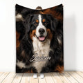 Bernese Mountain Dog throw blanket displayed upright with a close-up tricolor dog design