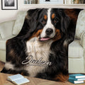 Close-up Bernese Mountain Dog throw blanket styled on a sofa with books nearby