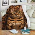 Bengal cat throw blanket draped across a sofa in a cozy living room setting