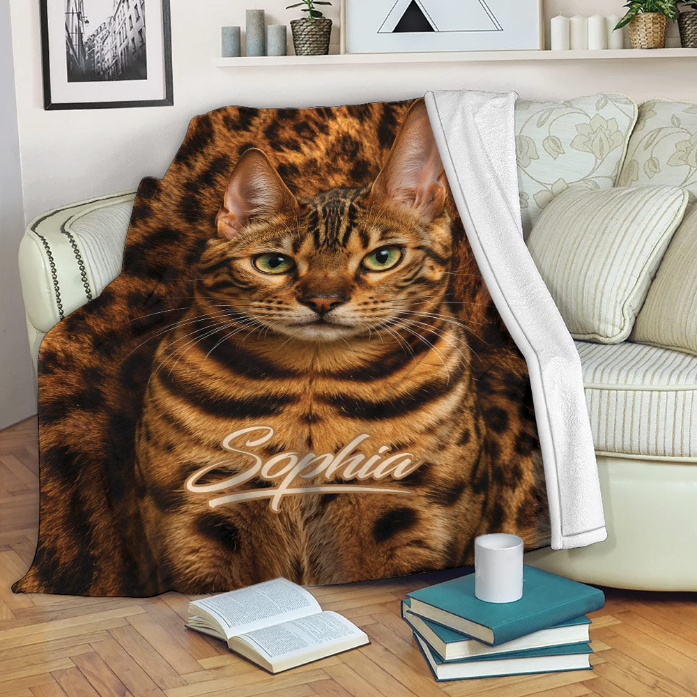 Bengal cat throw blanket draped across a sofa in a cozy living room setting