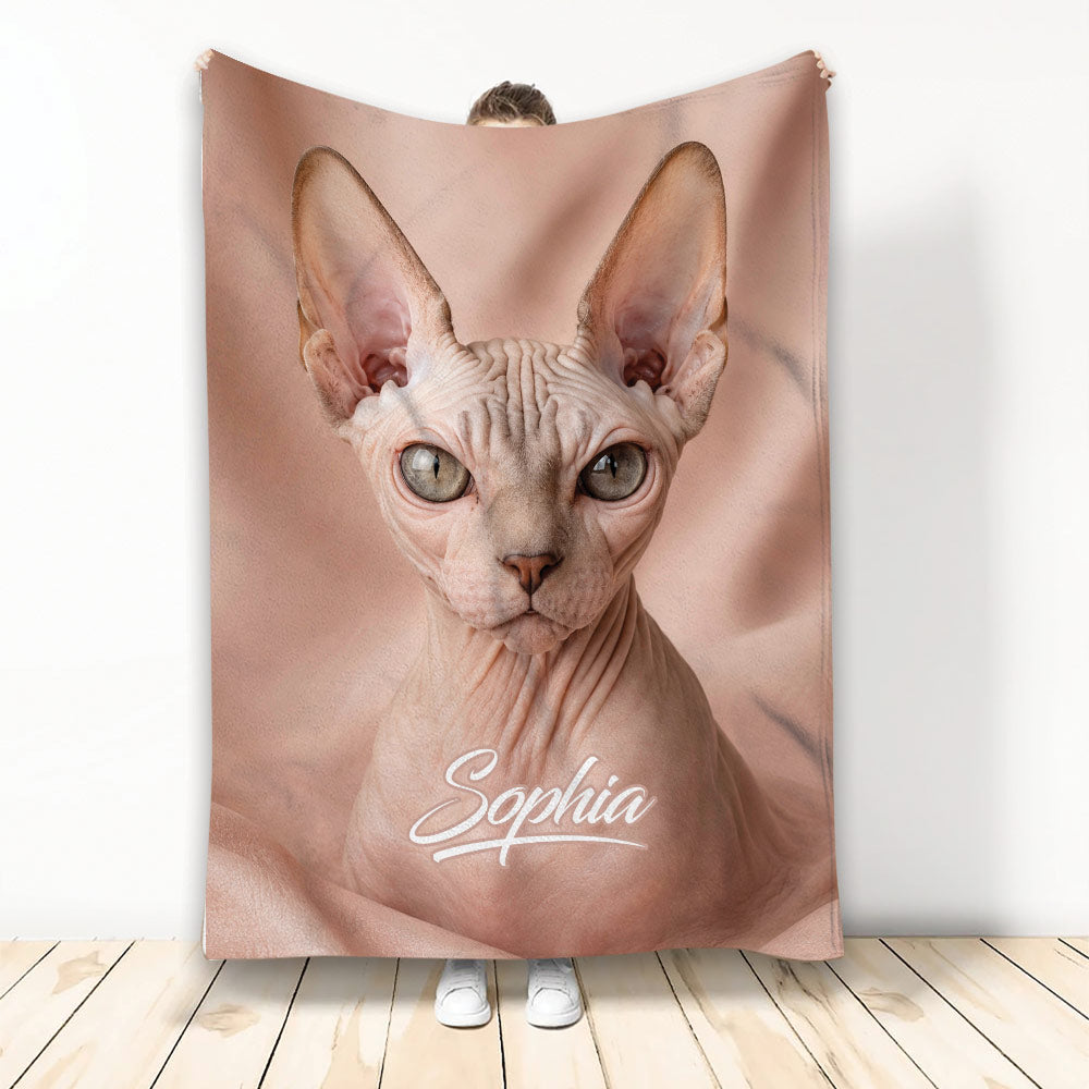 Sphynx cat throw blanket displayed upright with large hairless cat artwork in a soft blush palette