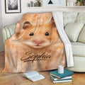 Golden hamster throw blanket draped over a sofa in a cozy living room