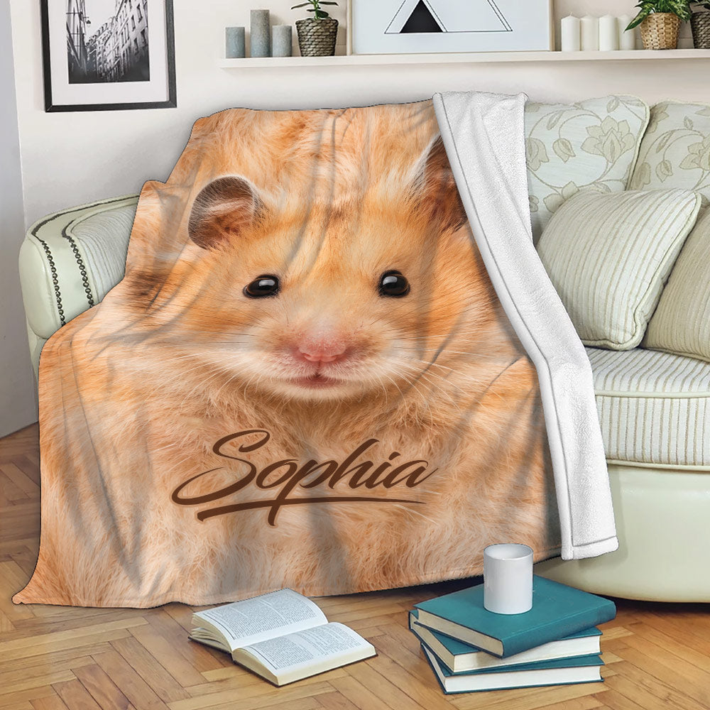Golden hamster throw blanket draped over a sofa in a cozy living room