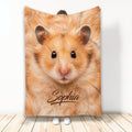 Hamster throw blanket displayed by a person, featuring a close-up golden hamster design