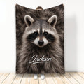 Raccoon throw blanket displayed vertically with a close-up woodland animal design
