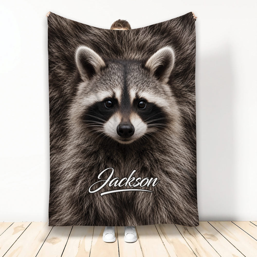 Raccoon throw blanket displayed vertically with a close-up woodland animal design