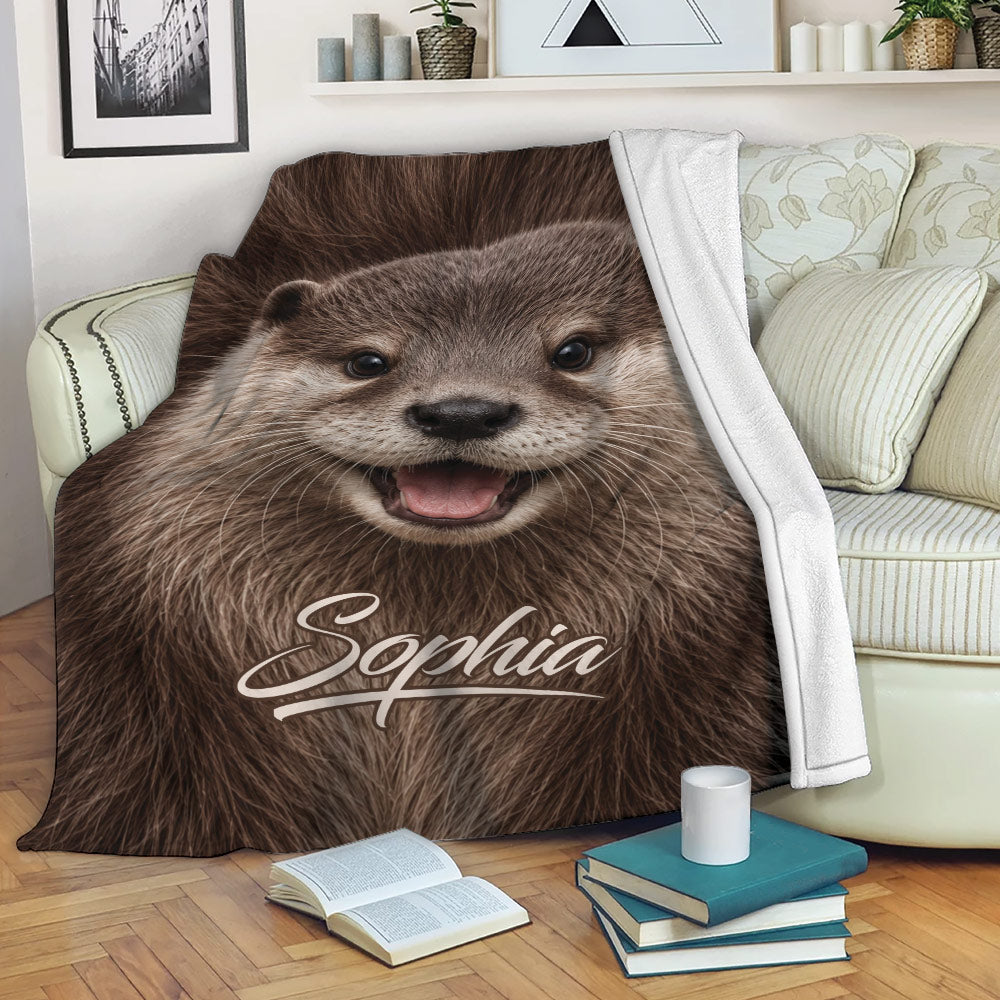 Otter throw blanket draped over a sofa with a cheerful wildlife face and cozy reading nook
