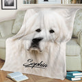 Great Pyrenees blanket styled on a sofa featuring detailed white dog face artwork