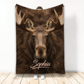 Realistic moose artwork on a blanket displayed vertically with large antlers and rich brown tones