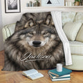 Gray wolf throw blanket draped across a sofa in a cozy living room