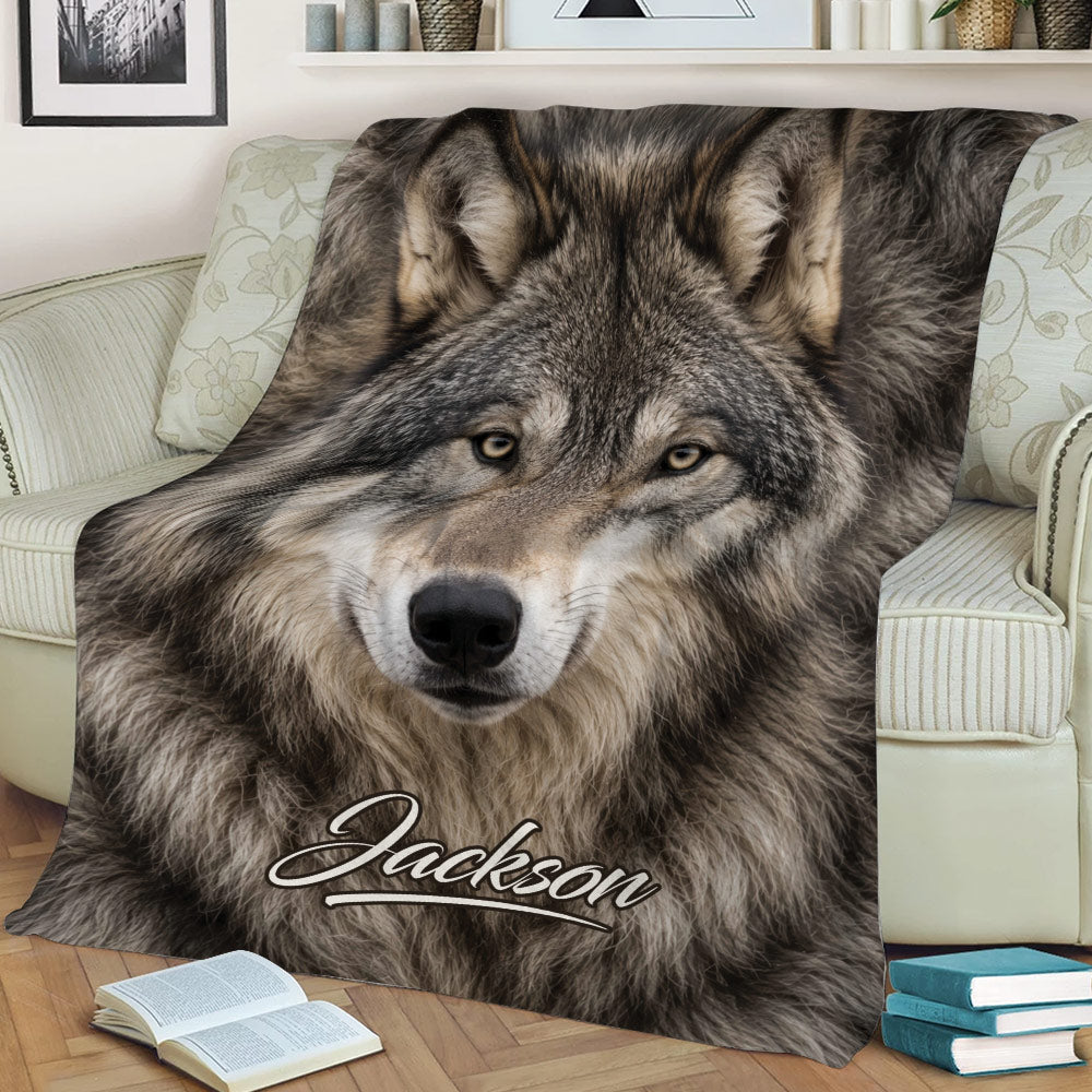 Close view of realistic gray wolf artwork on a living room throw blanket