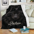 Black wolf throw blanket draped over a sofa in a cozy living room