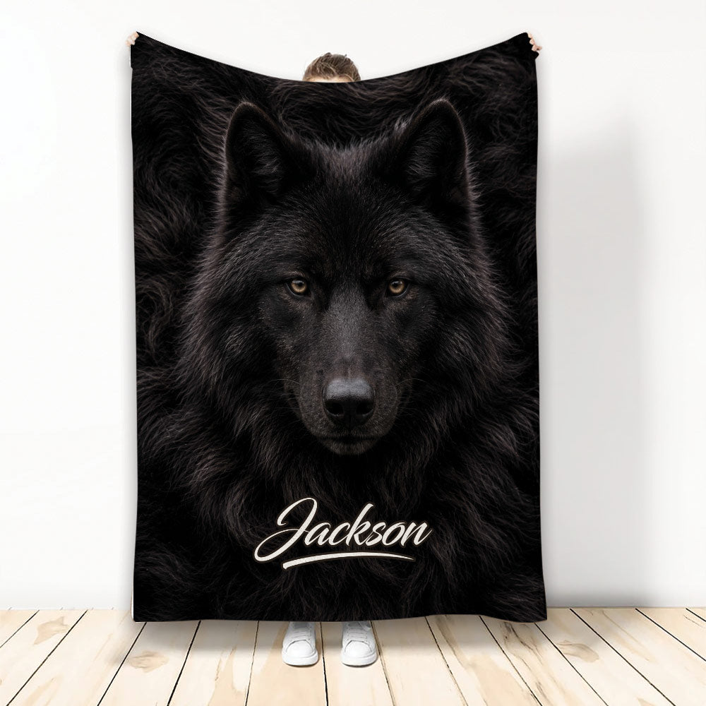 Black wolf throw blanket displayed upright with dramatic wildlife artwork