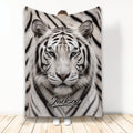 Tiger throw blanket with a dramatic close-up wildlife design displayed in a standing lifestyle setting