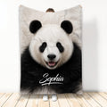 Panda throw blanket featuring a close-up black and white panda face in a room display