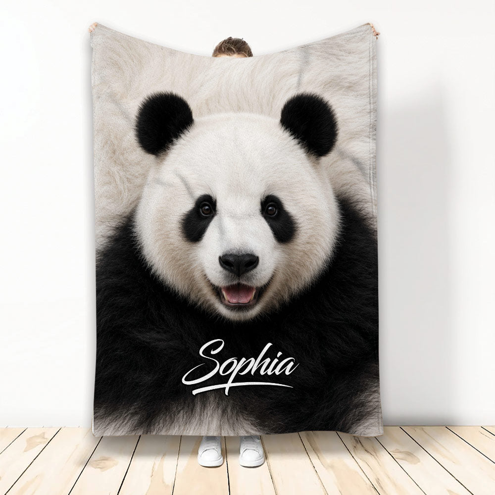 Panda throw blanket featuring a close-up black and white panda face in a room display