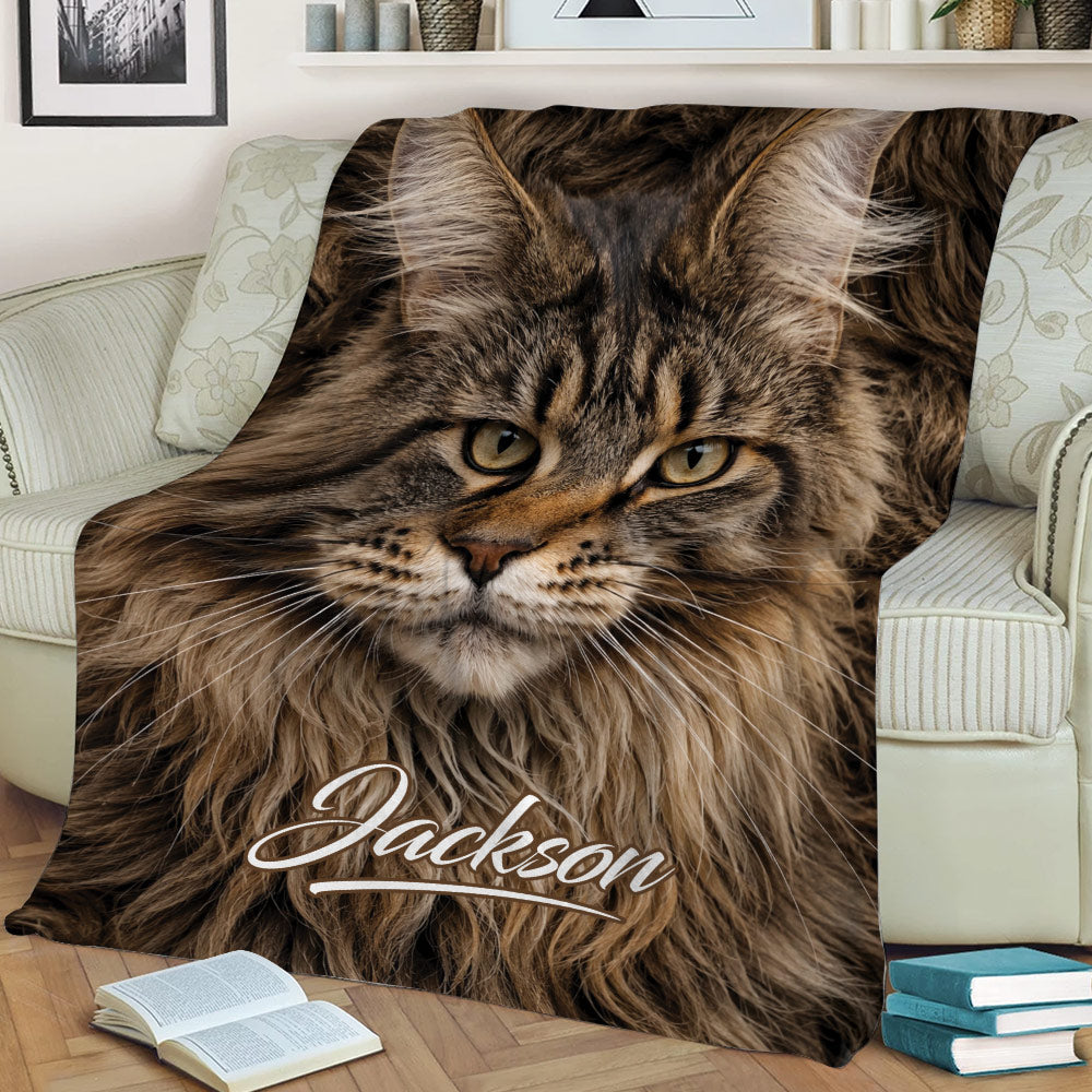 Close view of a Maine Coon throw blanket featuring a realistic cat face on a sofa