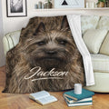Cairn Terrier blanket displayed on a sofa with cozy dog artwork and living room decor