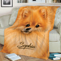 Close-up Pomeranian throw blanket styled on a sofa with books and home decor