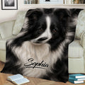 Black-and-white Border Collie throw blanket styled on a sofa with books nearby