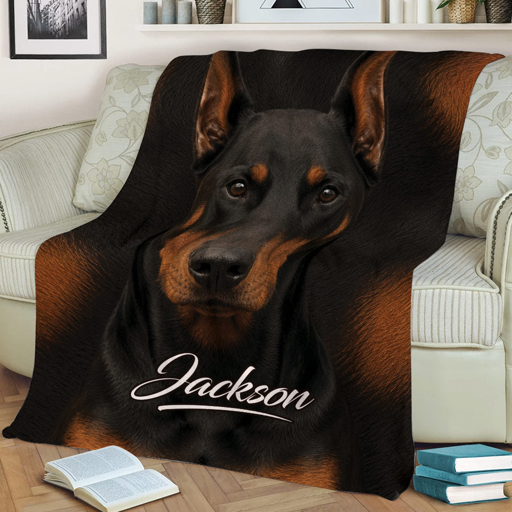 Close view of a realistic Doberman throw blanket styled across a comfortable sofa