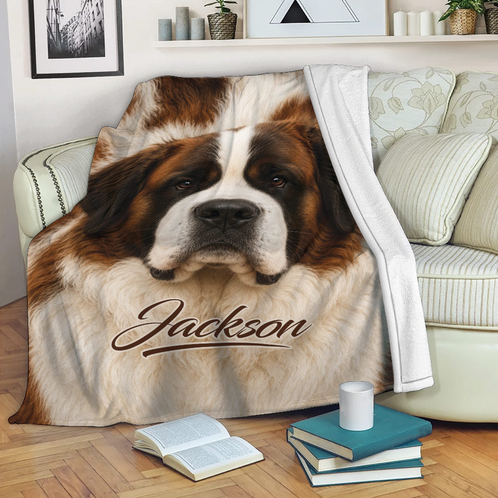 Saint Bernard blanket draped over a sofa in a cozy reading room with brown and cream dog artwork