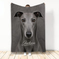 Greyhound throw blanket displayed upright with a realistic gray dog portrait on a dark background