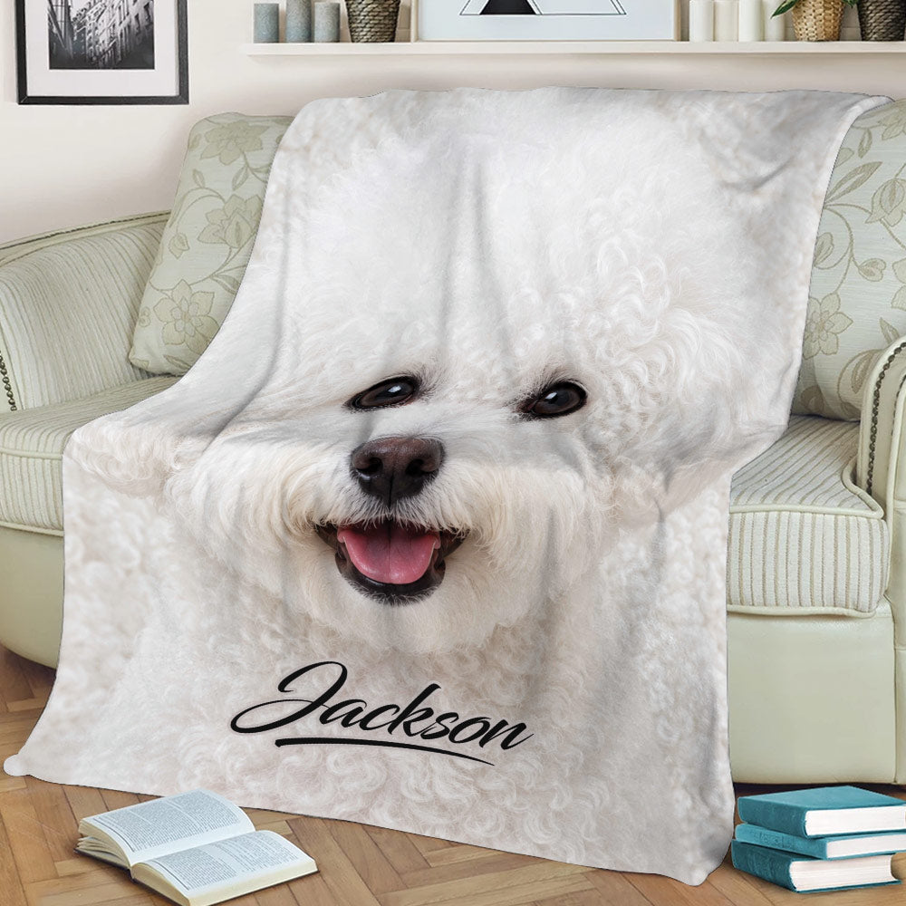 Close-up white Bichon Frise blanket design styled across a living room chair