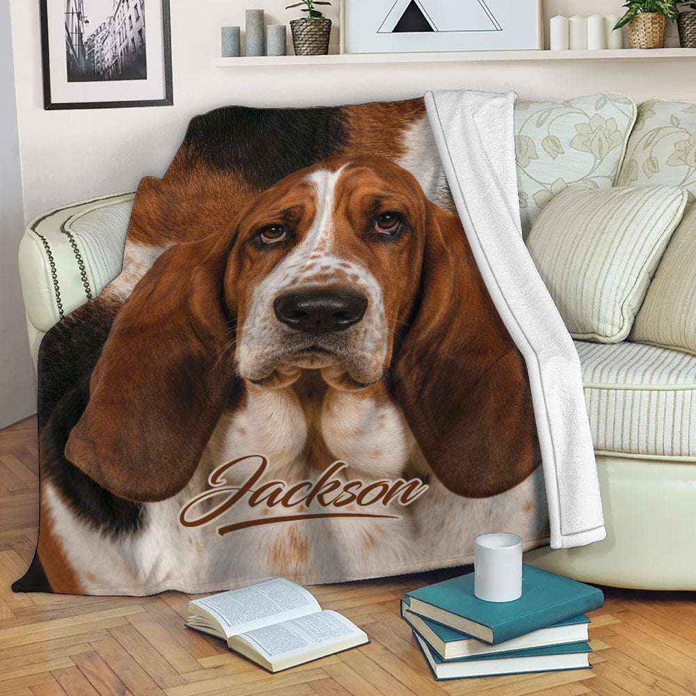 Basset Hound throw blanket displayed on a sofa in a cozy living room setting