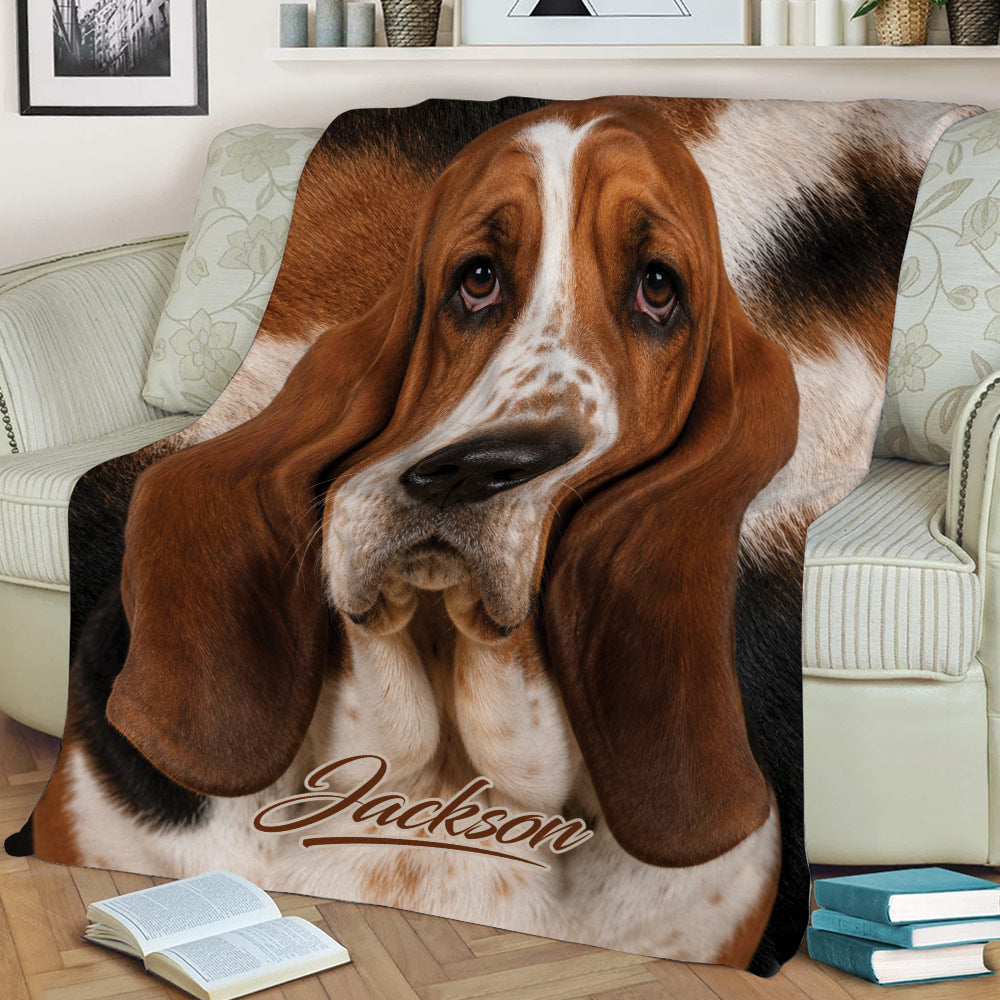 Basset Hound blanket with realistic dog artwork styled across a comfortable couch