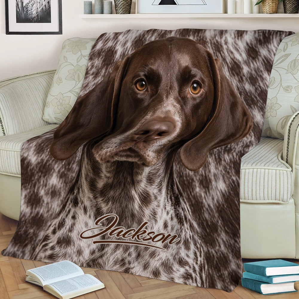 Close view of German Shorthaired Pointer artwork on a couch blanket