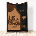 Custom bicycle throw blanket featuring a mountain biker, pine trees, mountains, helmets, and bicycle artwork