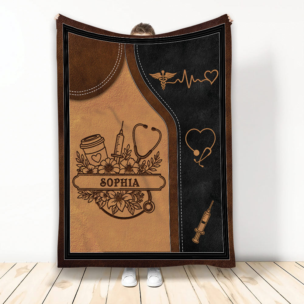 Caregiver throw blanket with stethoscope, syringe, heart symbols, coffee cup, and medical artwork