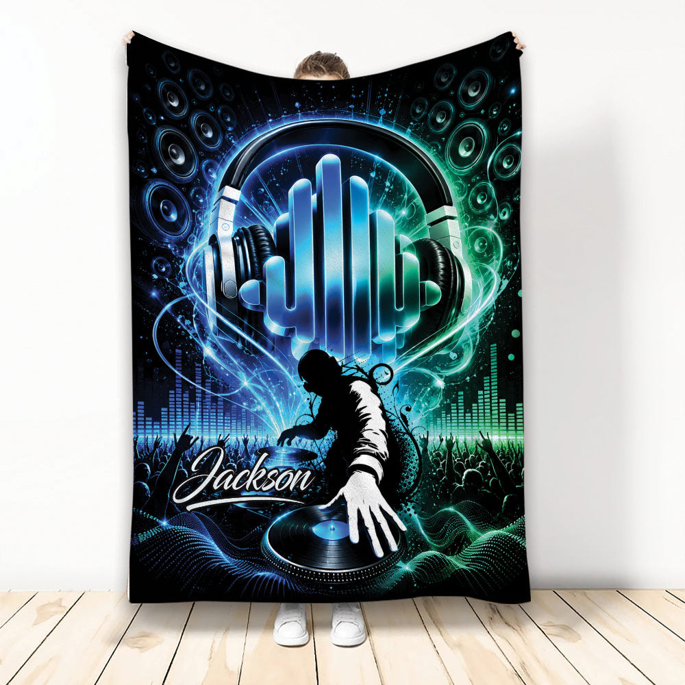 DJ throw blanket featuring headphones, turntable, speakers, concert crowd, and vivid blue and green music artwork