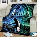 Colorful DJ blanket draped across a sofa with a headphone design, turntable, speakers, and crowd silhouette