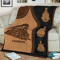 Close view of a custom railroader blanket with locomotive illustration and train motifs
