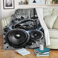 DJ throw blanket displayed on a sofa with microphone, headphones, speakers, and urban music studio artwork