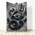 DJ throw blanket with microphone, headphones, speakers, turntable silhouette, and dramatic black and silver music artwork